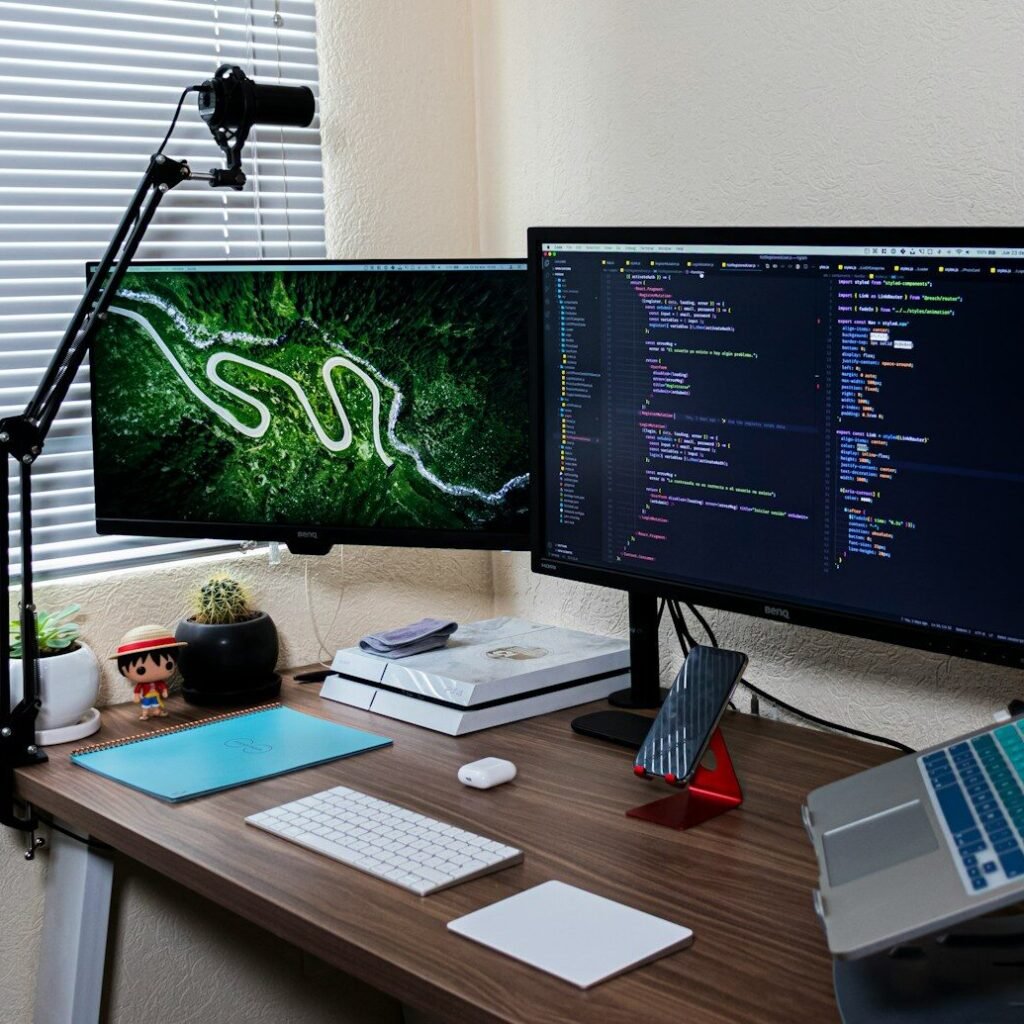 black flat screen computer monitor on brown wooden desk